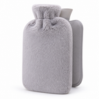 Hot water bottle with a soft plush cover and fleece sleeve