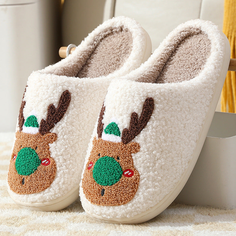 Warm slip-on house shoes with a festive elk design