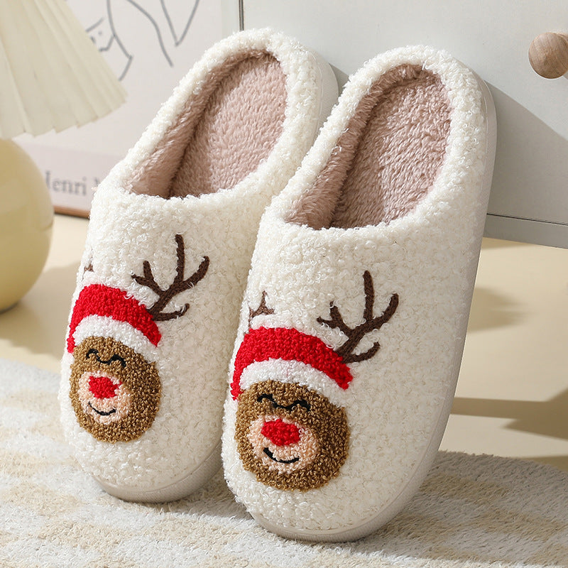 Cozy fuzzy Santa slippers arranged as a matching couple set