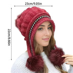 Women's pom-pom beanie styled as a cozy cold-weather accessory