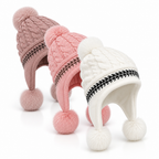 Side view of a cozy earflap beanie with braided knit detail