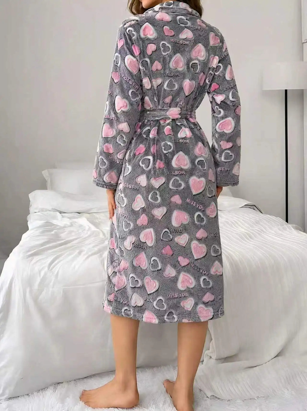 Close view of the flannel texture on a women's calf-length robe