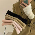 Pair of warm fingerless gloves arranged side by side