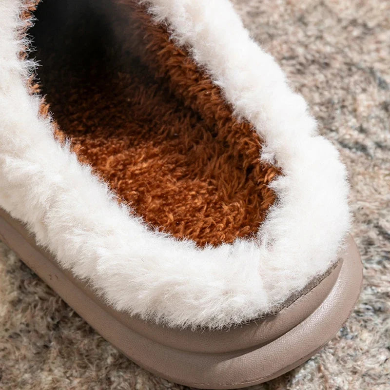 Pair of cozy fleece-lined slippers with easy slip-on styling