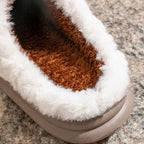Pair of cozy fleece-lined slippers with easy slip-on styling