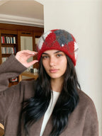Top view of a knit beanie with a distinctive diamond pattern